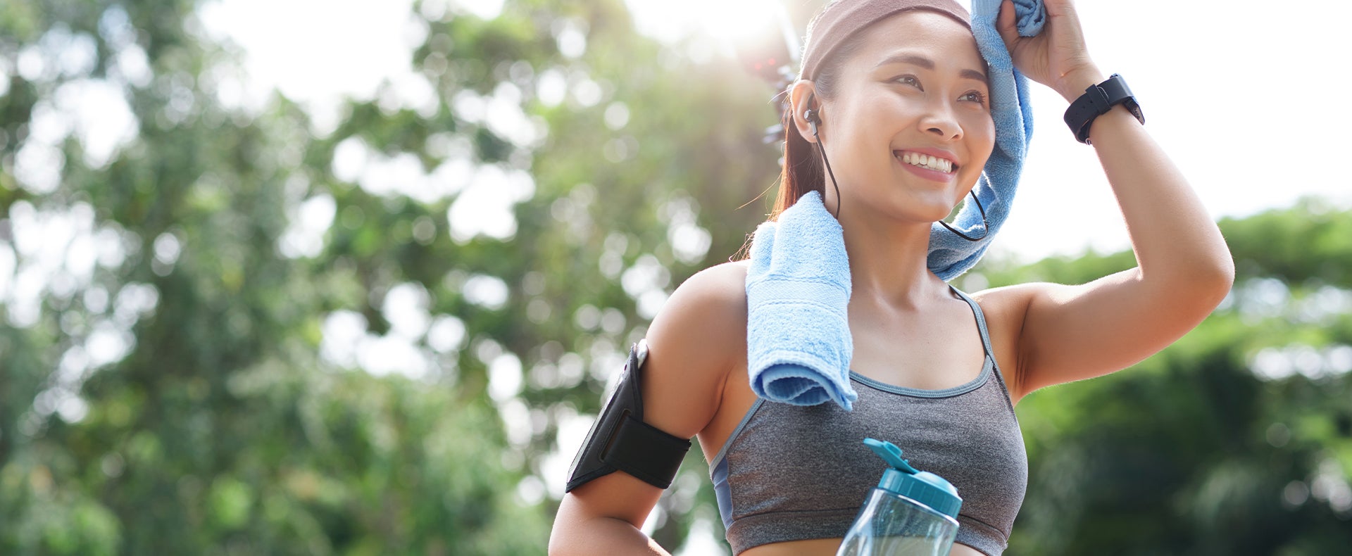 Woman wiping sweat from her face after a workout