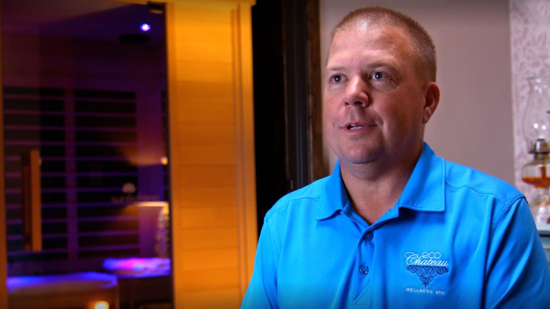 A wellness spa owner talking about the benefit of infrared sauna.