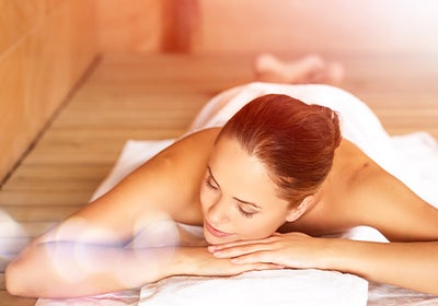 Woman laying down in sauna