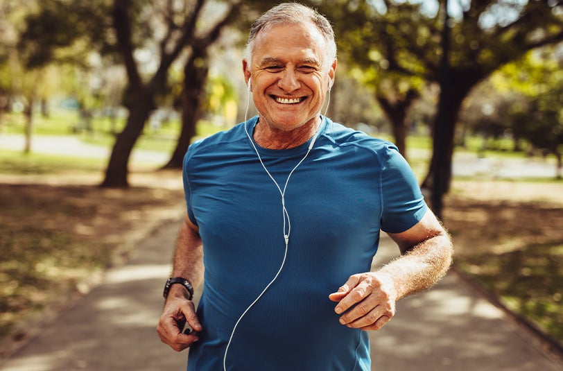 Man smiling while running.