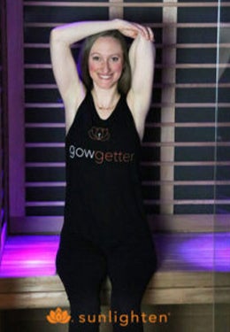 Seated tricep stretch in sauna