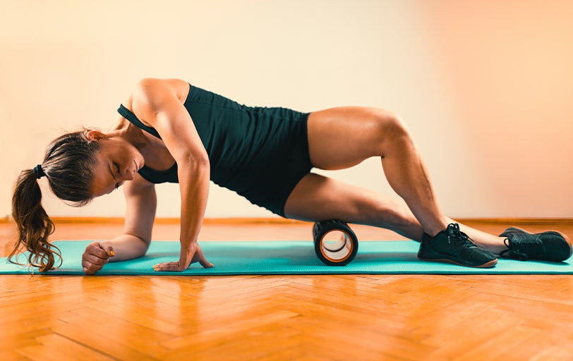Woman using a foam roller