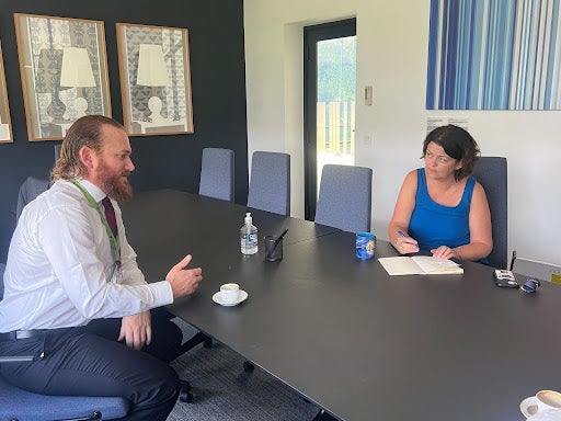 Houlihan explains the anticipated impact of the solutions with the Vedis Vik, Envoy Climate &amp; Forest, at Royal Norwegian Embassy in Brasilia, Brazil. Norway is a key supporter of Brazil’s Amazon Fund which accepts international financial support for efforts to fight deforestation. Photo by Kev Marriott.