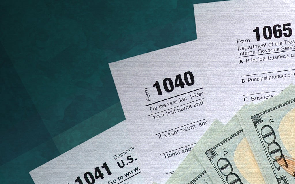 Dark green background showing tax forms and cash