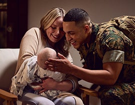 Military couple with a new baby.