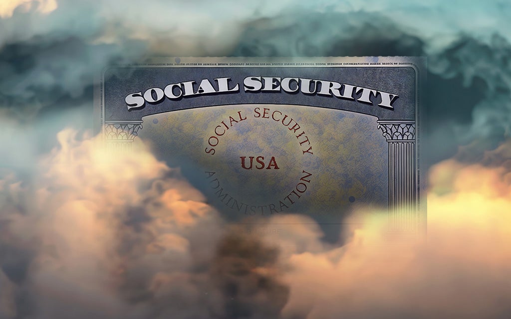 A social security card sitting in a mist of clouds and fog.