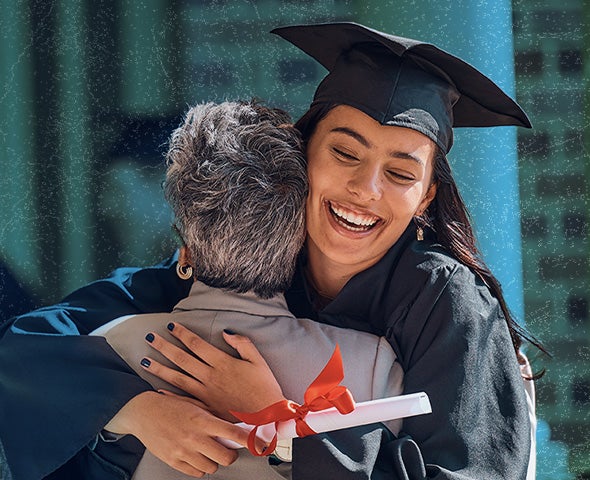 graduate in cap and gown hugging an elderly family member