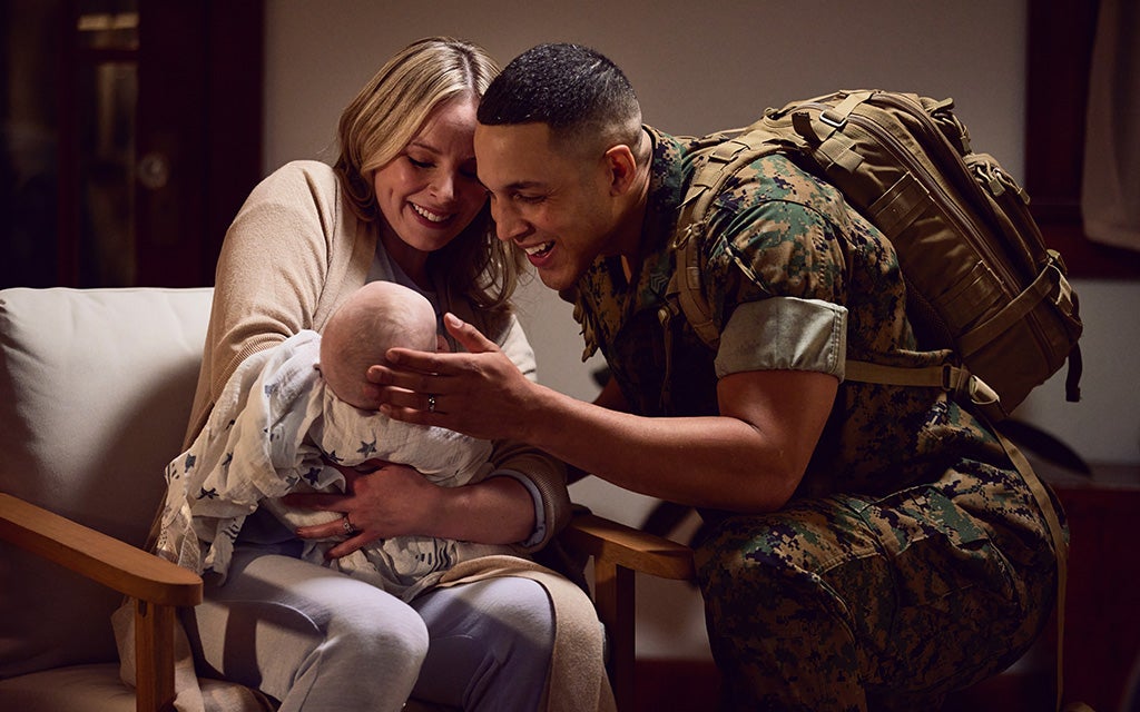 Military couple with a new baby.