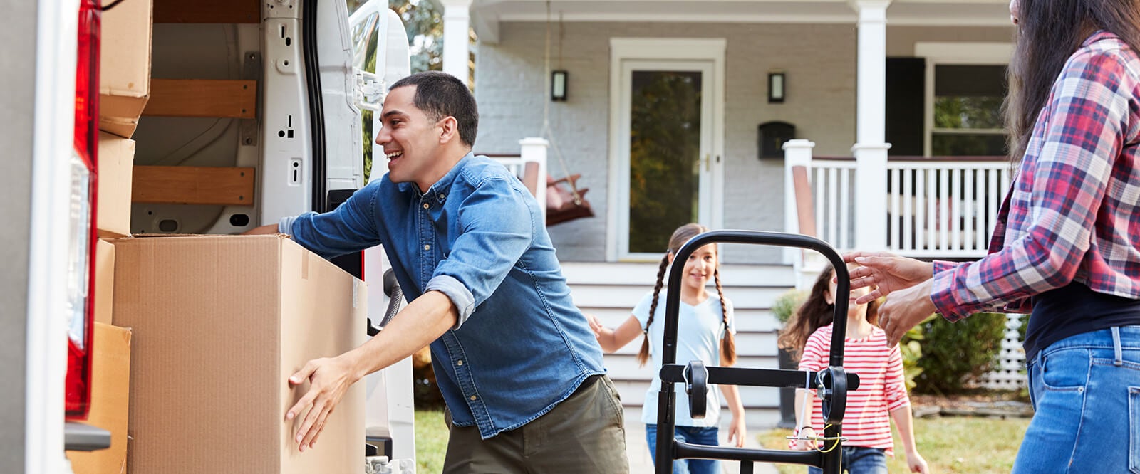 A young family packing a moving truck during a PCS.