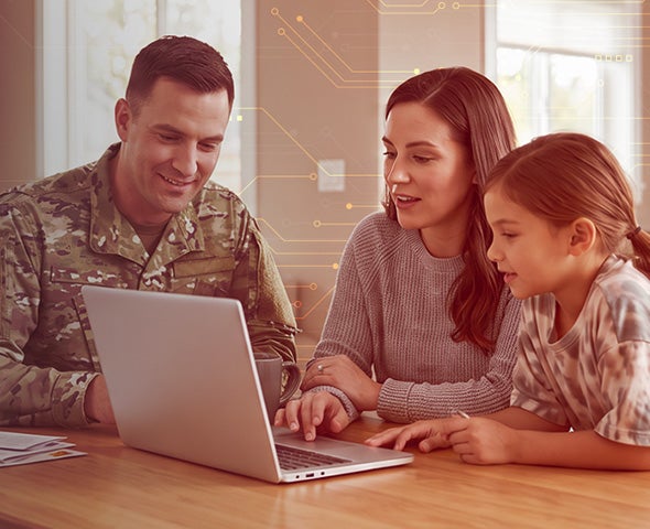 Military family looking at a computer screen.