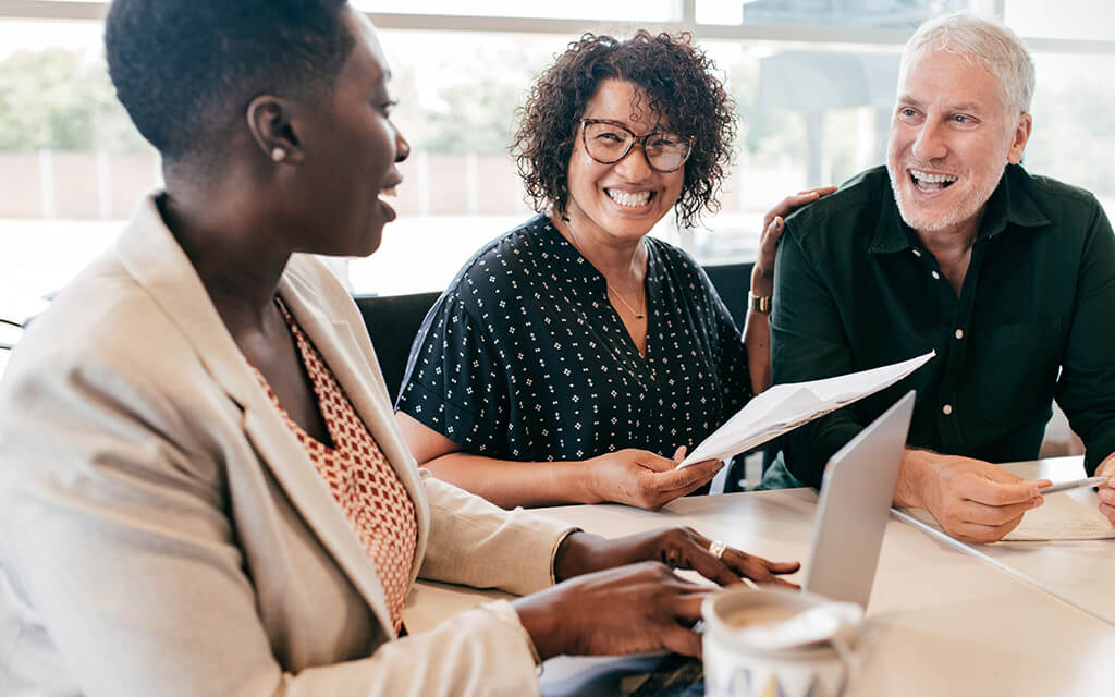 An image of an financial advisor speaking to a couple.