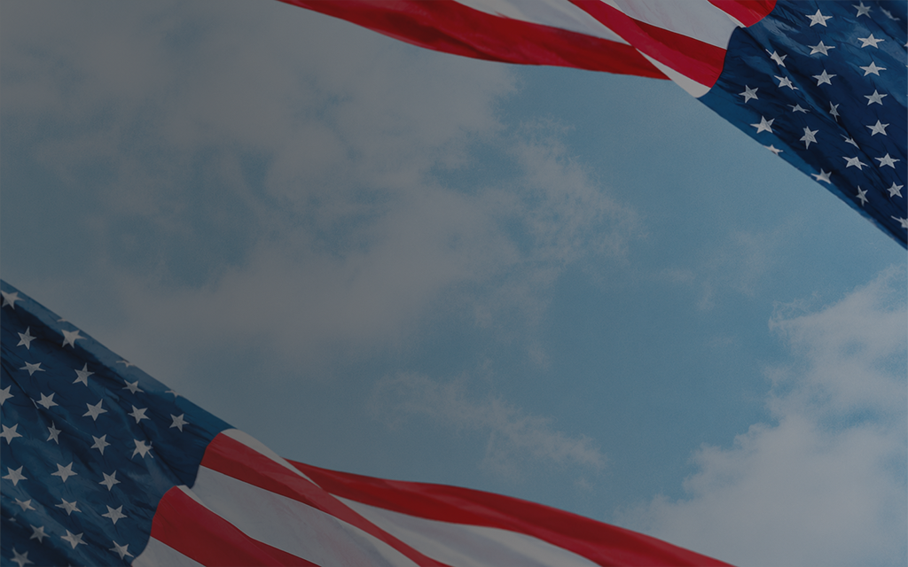 Image of the sky and clouds with two flags partially covering the corners