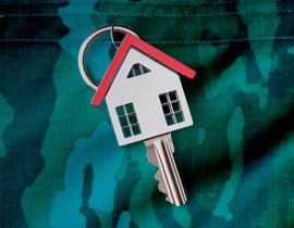 New home key with a house and a green camouflage background