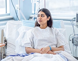 Woman laying in hospital bed