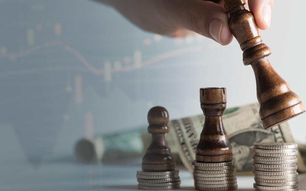 Chessboard with pieces placed atop of coins