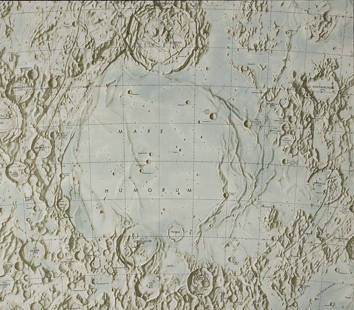 The map of Mare Humorum (Sea of Humors) contains a variety of lunar surface features. Most notable are the wrinkle ridges to the right of the mare basin. The crater Gassendi is at top left; it may be compared with the photobase drawing by Krieger (see item 27).