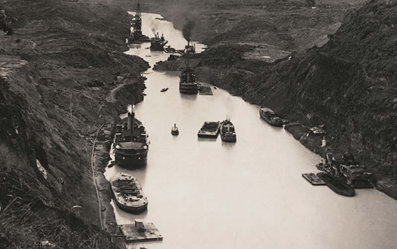 A French crane boat Alexandre La Valley makes the first transit through the Panama Canal seven months before the official opening.