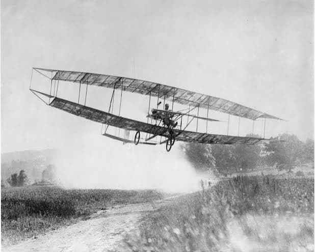 June Bug in the air, designed by Glenn Curtiss, with Curtiss at the controls, July 4, 1908 (the-leader.com)