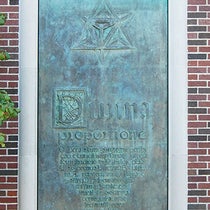 Bronze panel no. 1, based on the title page, Divina proportione, by Luca Pacioli, 1509, with one of Leonardo da Vinci's woodcut polyhedrons added at top; cast by Bruno Bearzi, 1965, north exterior annex wall, Linda Hall Library