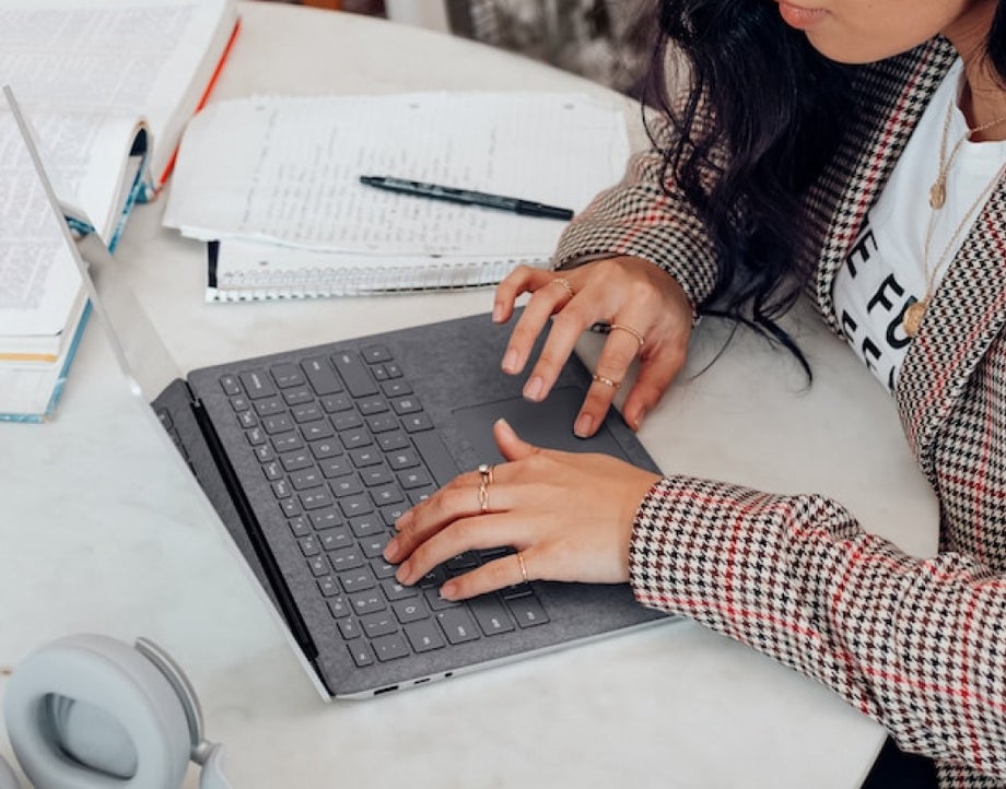 A person with hands on a keyboard