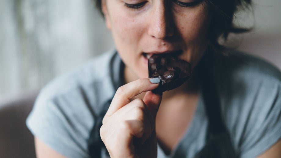 Person eating a chocolate