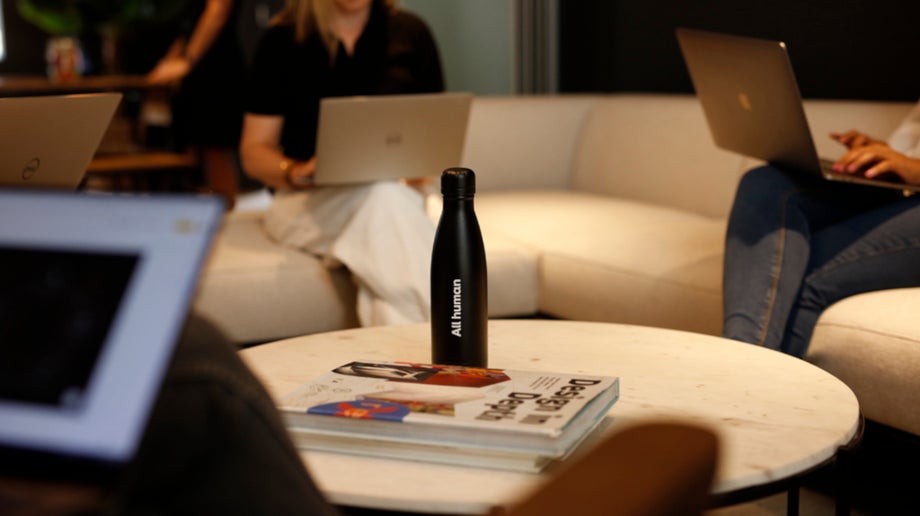 An All human water bottle on a table