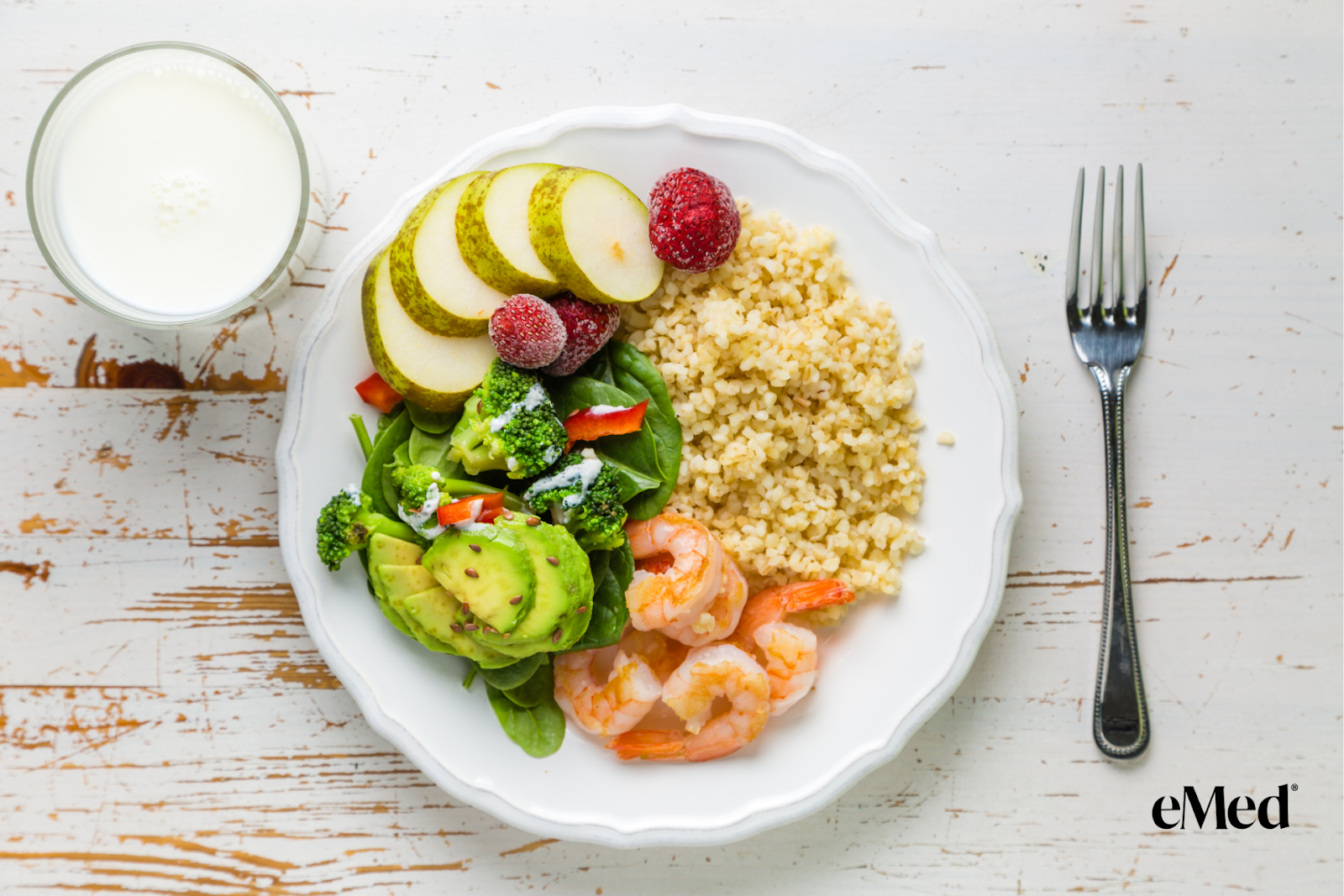 A balanced portion of food on a plate with prawn, milk and broccoli