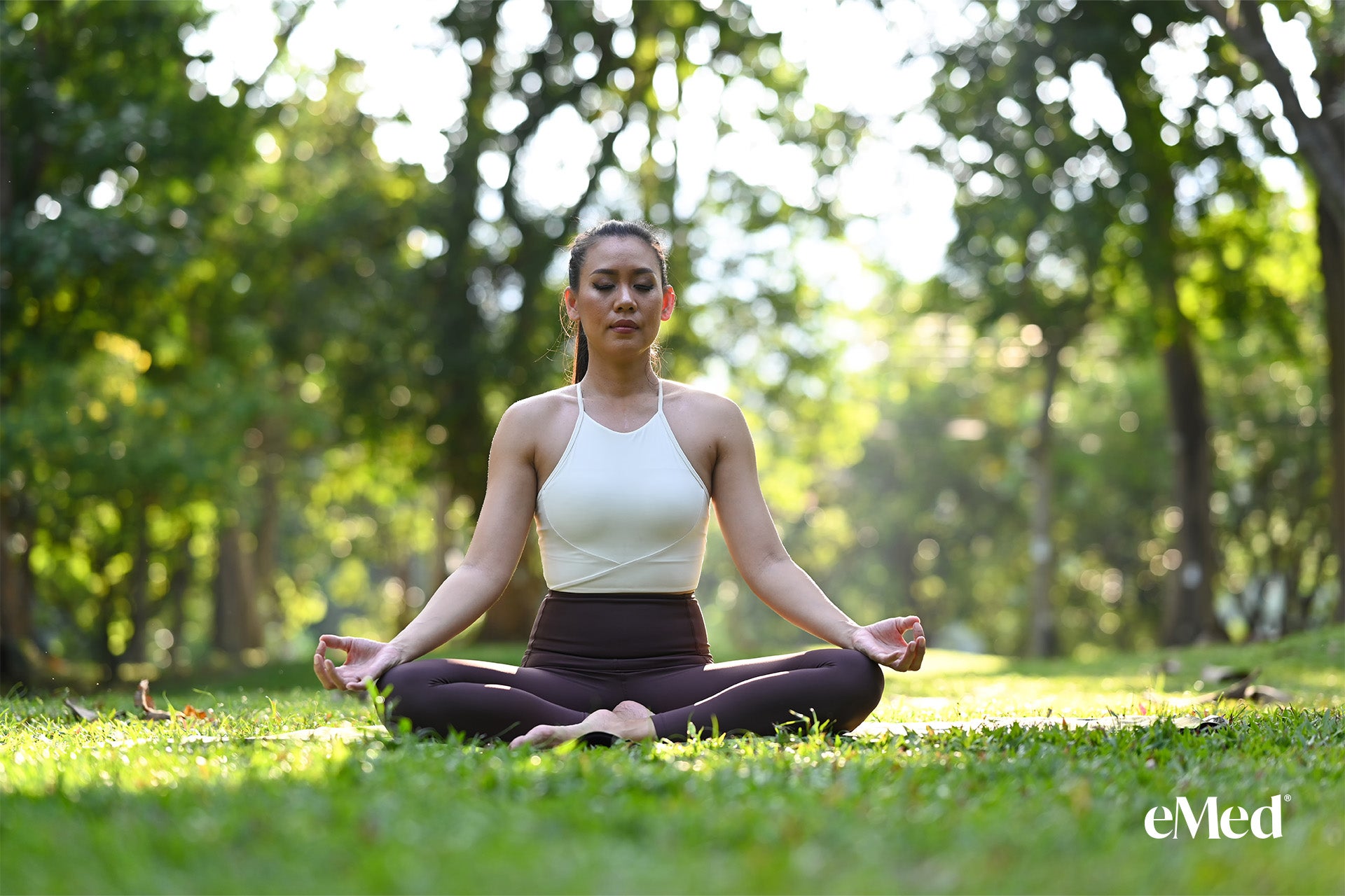 A person meditating in a serene outdoor setting